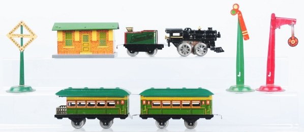 American Flyer O-Gauge Passenger Train Set.: Set includes clockwork steam engine, no. 120 tender, one passenger pullman car, and one passenger observation car. Passenger cars marked "Oriental Limited". Set also comes with a tin railroad building