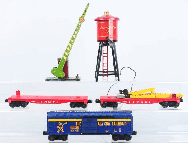 Lot of Pre and Post-War Train Items.: Includes American Flyer No. 215 Water Tower in partial original box, Lionel No. 77 Crossing Gate, and three post-war Lionel freight cars consisting of very rare No. 6816 Flat Car with Bulldozer pieces