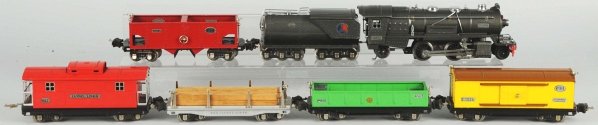 Lionel 1-Gauge No. 263 Freight Train Set.: American. Includes no. 263E engine with matching whistle tender, both in gunmetal gray. Also includes no. 814 boxcar, no. 812 gondola, no. 811 lumber car with original wooden load, no. 816 hopper car,