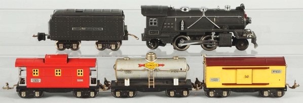 Lionel O-Gauge No. 249 Freight Train Set.: American. Pre-war. Includes no. 249E steam engine, no. 265 whistle tender, no. 655 boxcar, no. 654 Sunoco tank car, and no. 657 caboose. The entire set has nickel trim. Some scratching and paint loss 