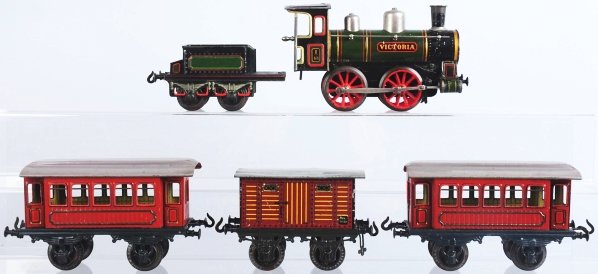 Tinplate Bing 1-Gauge Victoria Train Set.: Includes steam-type engine marked "Victoria" and on sides of cab the number "48". Also includes tender and three passenger cars. Some minor scratching and wear throughout. Condition (Excellent).