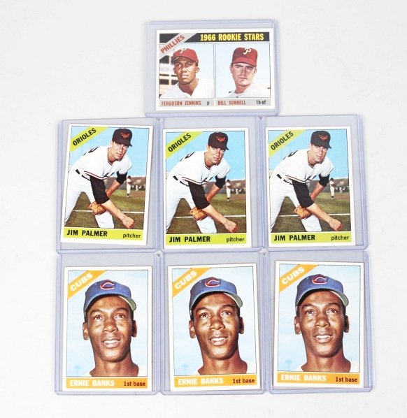 Lot of 7: Topps 1966 Baseball Cards.: Includes three no. 126 Jim Palmer cards, three no. 110 Ernie Banks cards, and one no. 254 Ferguson Jenkins rookie card. All three players are HOFers. Cards are all well centered. Condition (Very Good)