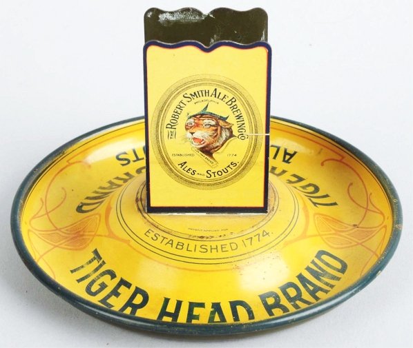 Tin Litho Robert Smith Ale Brewing Co. Ashtray.: Pre-prohibitin. Tiger Head Brand Ales and Stouts. Incredible double-sided graphics of the tiger's head with some light wear and scratching throughout. Several cigarette burns to ashtray base. Conditio