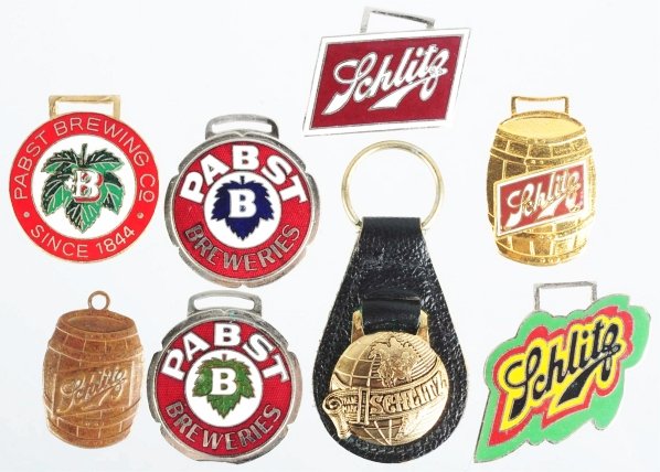 Lot of 8: Schlitz & Pabst Beer Fobs.: The Pabst fobs are all nicely enameled version with just light wear and the Schlitz fobs all appear to be newer styles. Condition (Very Good - Excellent). Size Largest: 2 - 1/2" T.