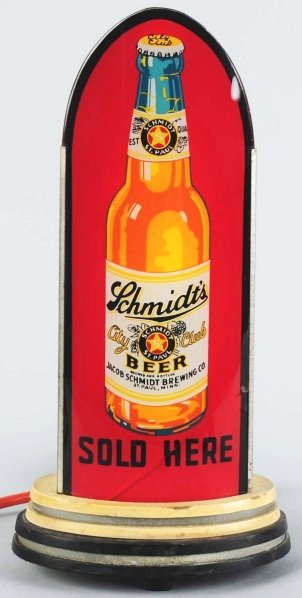 Schmidt's Beer Reverse Glass Light-Up Bullet Sign: Jacob Schmidt Brewing Company. Wonderful labeled bottle scene. Glass is nice and clean. One crack across bottom (below bottle) and wooden base has some overall wear. Condition (Good - Very Good). Size