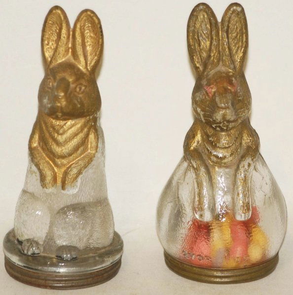 Lot of 2: Glass Candy Containers.: Both are standing rabbits with original tin closures. With 80% paint. Condition (Excellent). Size Each: 5 - 1/4" T.
