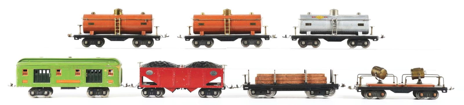 LOT OF 7: STANDARD GAUGE PIECES OF ROLLING STOCK: (A) No. 310 Baggage Car in apple green, excellent condition. (B) No. 515 terracotta Tank Car in excellent condition. (C) No. 515 Tank Car with some paint chips. (D) No. 515 silver Sonoco Tank Car with