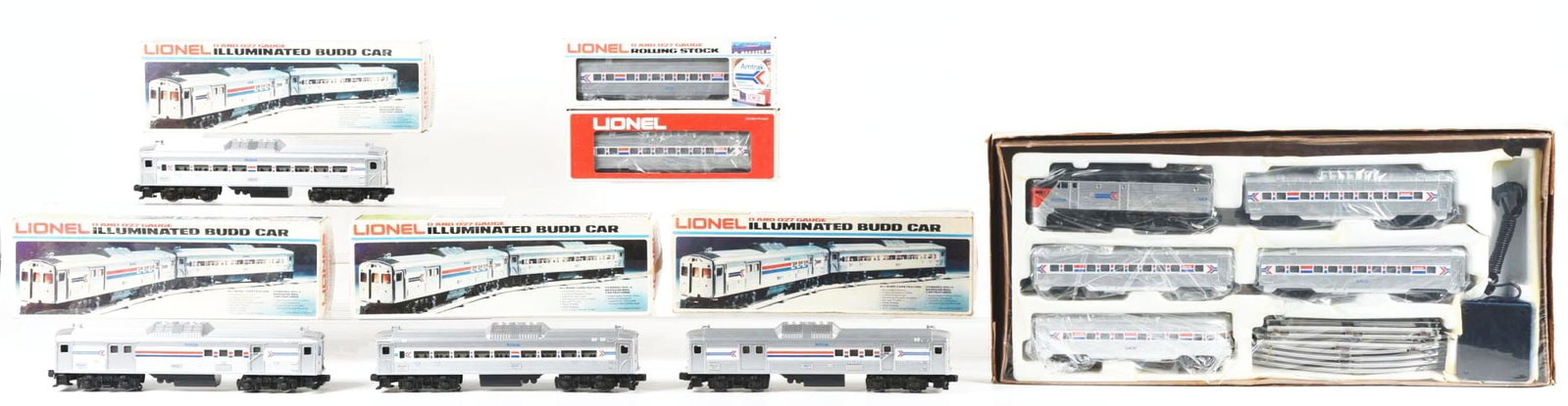 LOT OF 7: AMTRAK LOCOMOTIVES & PASSENGER CARS: Lot consists of: a No. 1663 Amtrak Lake Shore Limited Passenger Set, mint sealed in box; a No. 8876 Amtrak RDC1 Passenger Car; a No. 8871 Baggage Car; a No. 8868 Baggage Mail Car; a No. 8869 Passenger
