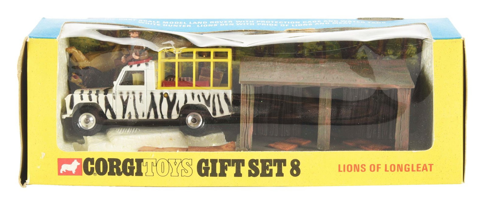 CORGI LIONS OF LONGLEAT TOY GIFT SET NO. 8: Original box. Early version with zebra stripe Land Rover, issued between 1964 and 1968. Open hatch roof with keeper and lions. Looks complete, including rifle. Some bending to cardboard. Condition: (V