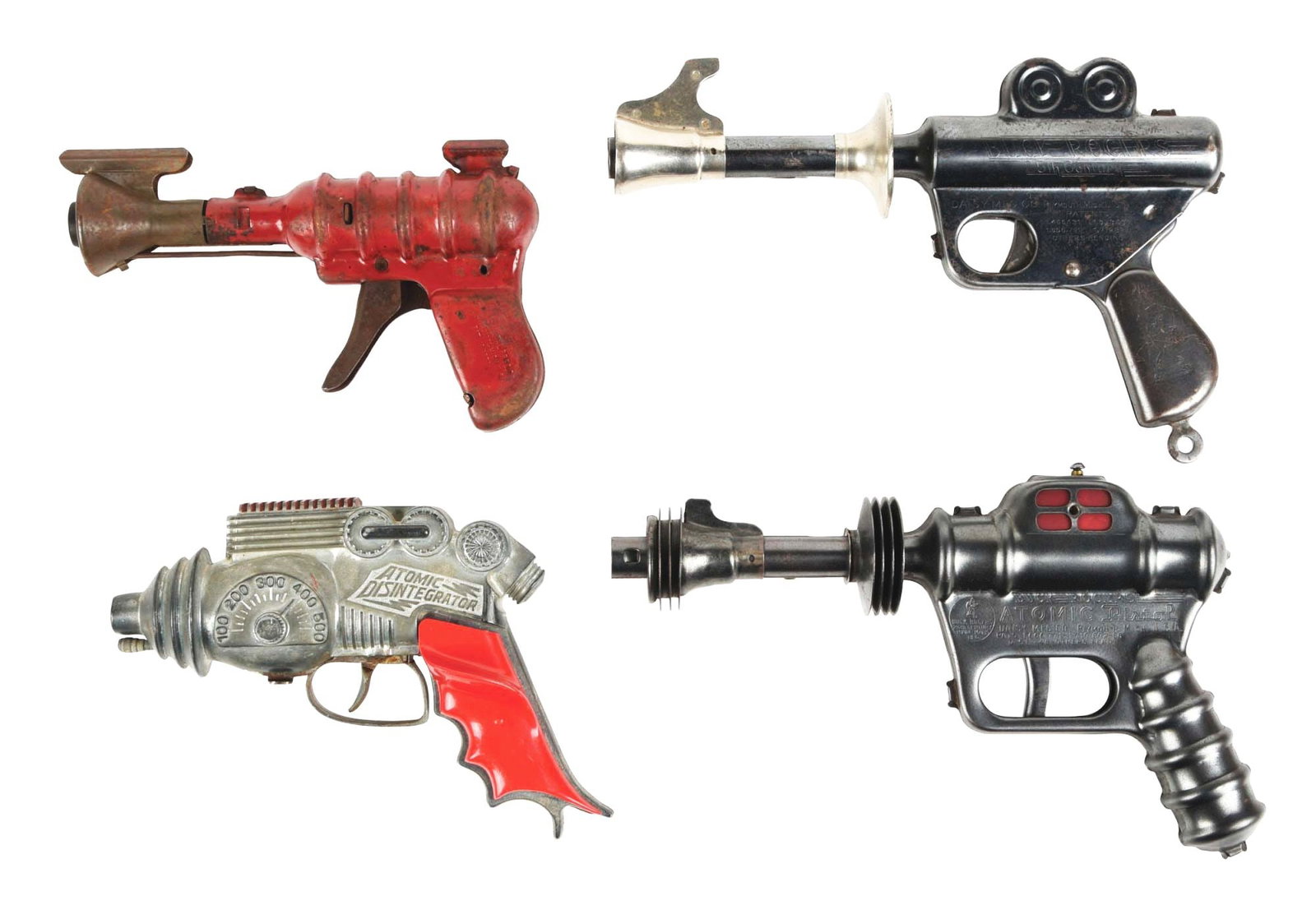 LOT OF 4: AMERICAN-MADE CAST & PRESSED STEEL RAY GUNS: Two Daisy Buck Rogers guns, one is an atomic pistol and the other is a slightly smaller version. Wyandotte gun and Hubley Atomic Disintegrator gun. All seem to work. Various conditions. Condition: (Ve