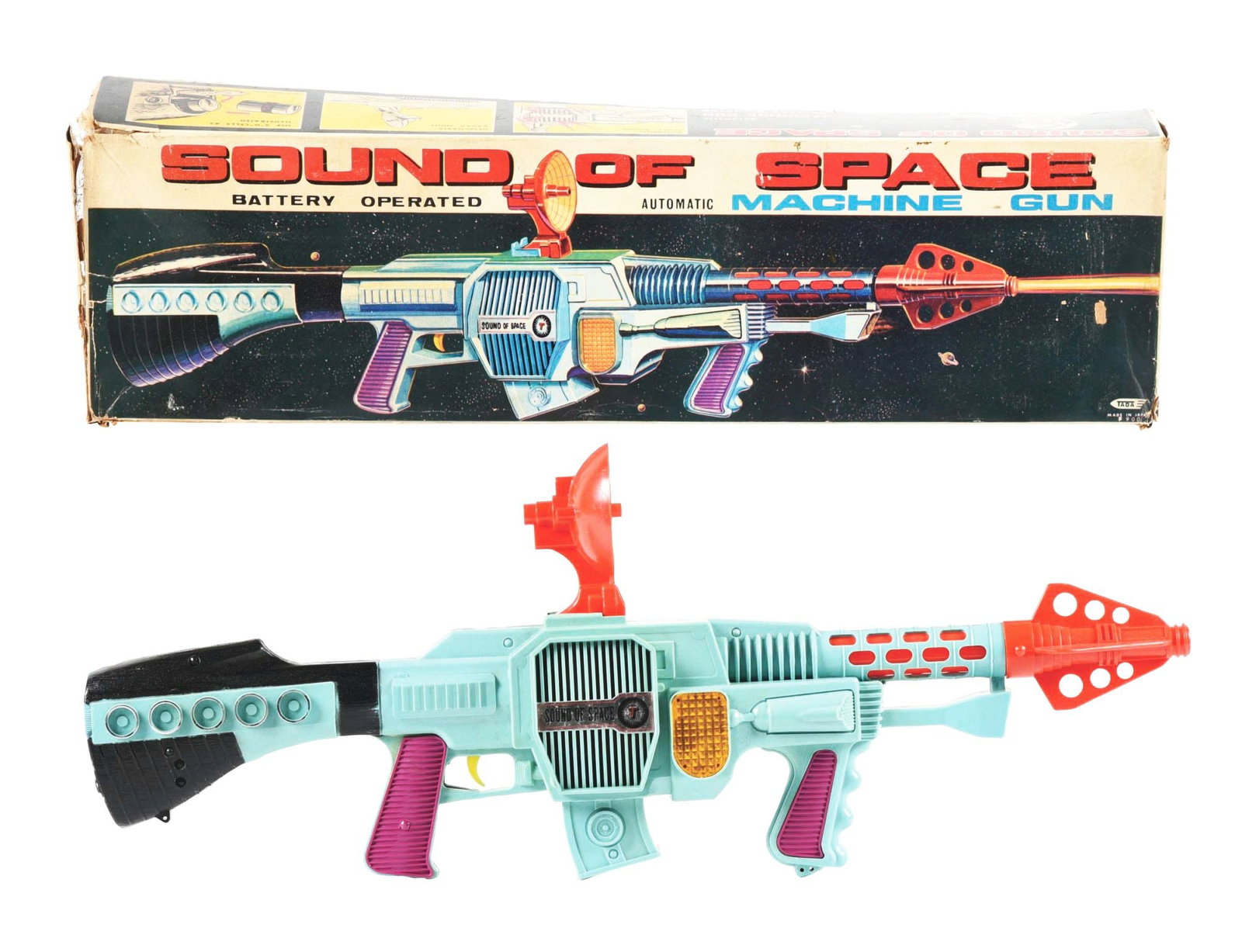 JAPANESE BATTERY-OPERATED SOUND OF SPACE MACHINE GUN IN ORIGINAL BOX: Marked "Tada Made in Japan." Very colorful box lid. Gun looks unused with cardboard inserts. Includes removeable sight. Gun is made of colorful plastic. Box has some splitting on two side aprons and t