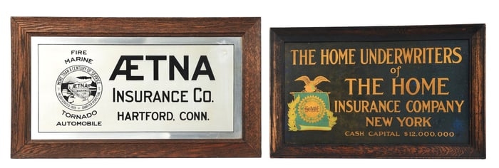 COLLECTION OF 2: METAL INSURANCE SIGNS W/ WOOD FRAMES.