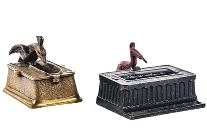 A PAIR OF BRONZE & CAST IRON MATCH DISPENSERS