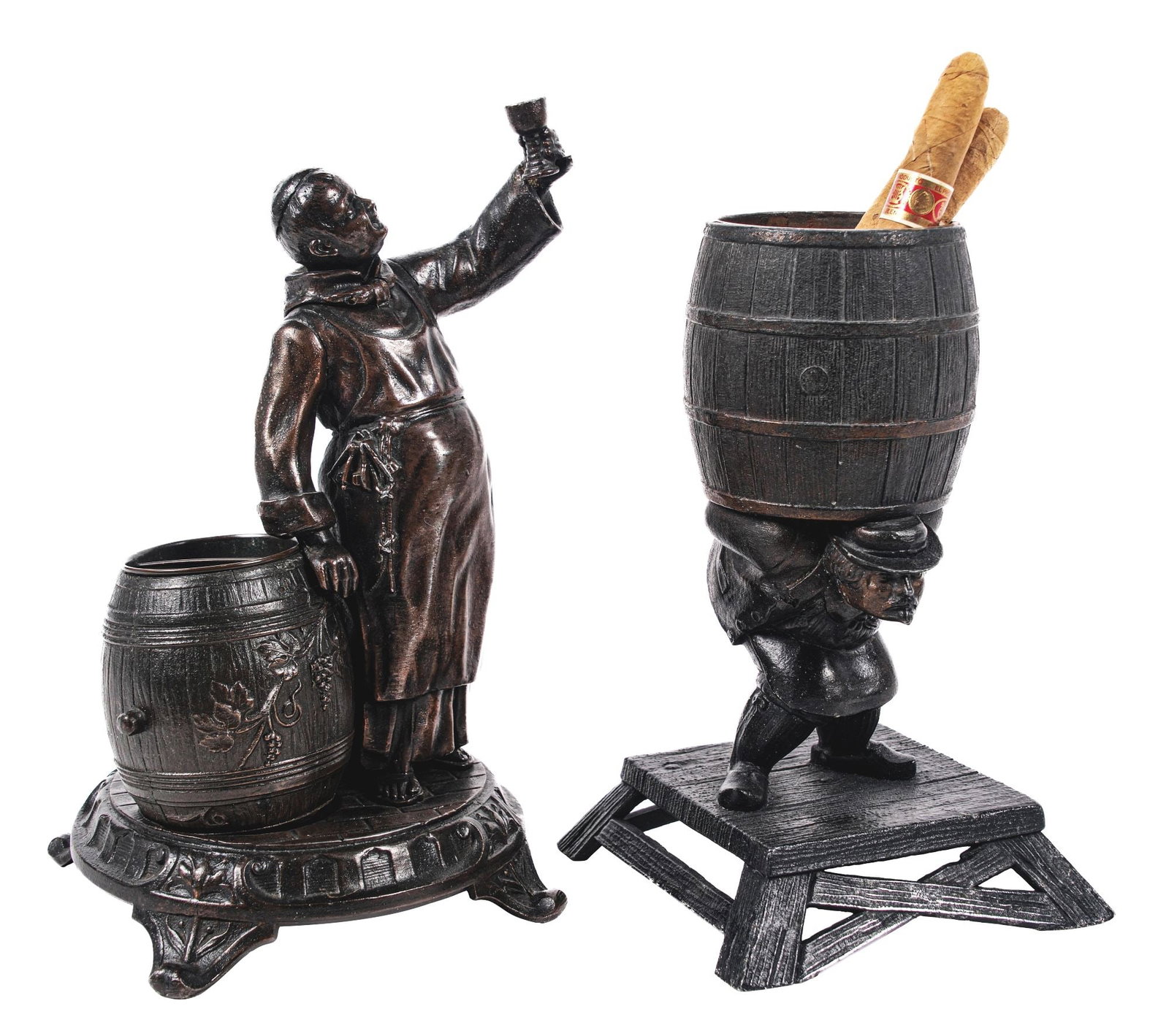 A PAIR OF CAST DESKTOP SMOKING ACCESSORIES: This is a pair of desktop smoking accessories. (A) A cast bronze cigar holder and cutter in the form of an early friar. The barrel holds the cigars, and the stand in the back is for box matches, as we