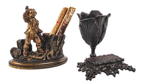 A PAIR OF CAST IRON & BRONZE MATCH & CIGAR HOLDERS