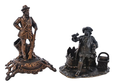 A PAIR OF CAST IRON & BRONZE CIGAR & MATCH HOLDERS