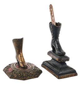 A PAIR OF FIGURAL CAST IRON MATCH HOLDERS