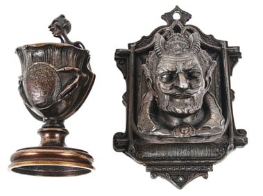 A PAIR OF BRONZE MATCH HOLDERS