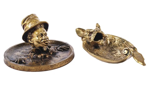 A PAIR OF FIGURAL BRONZE ASHTRAYS & MATCH HOLDERS