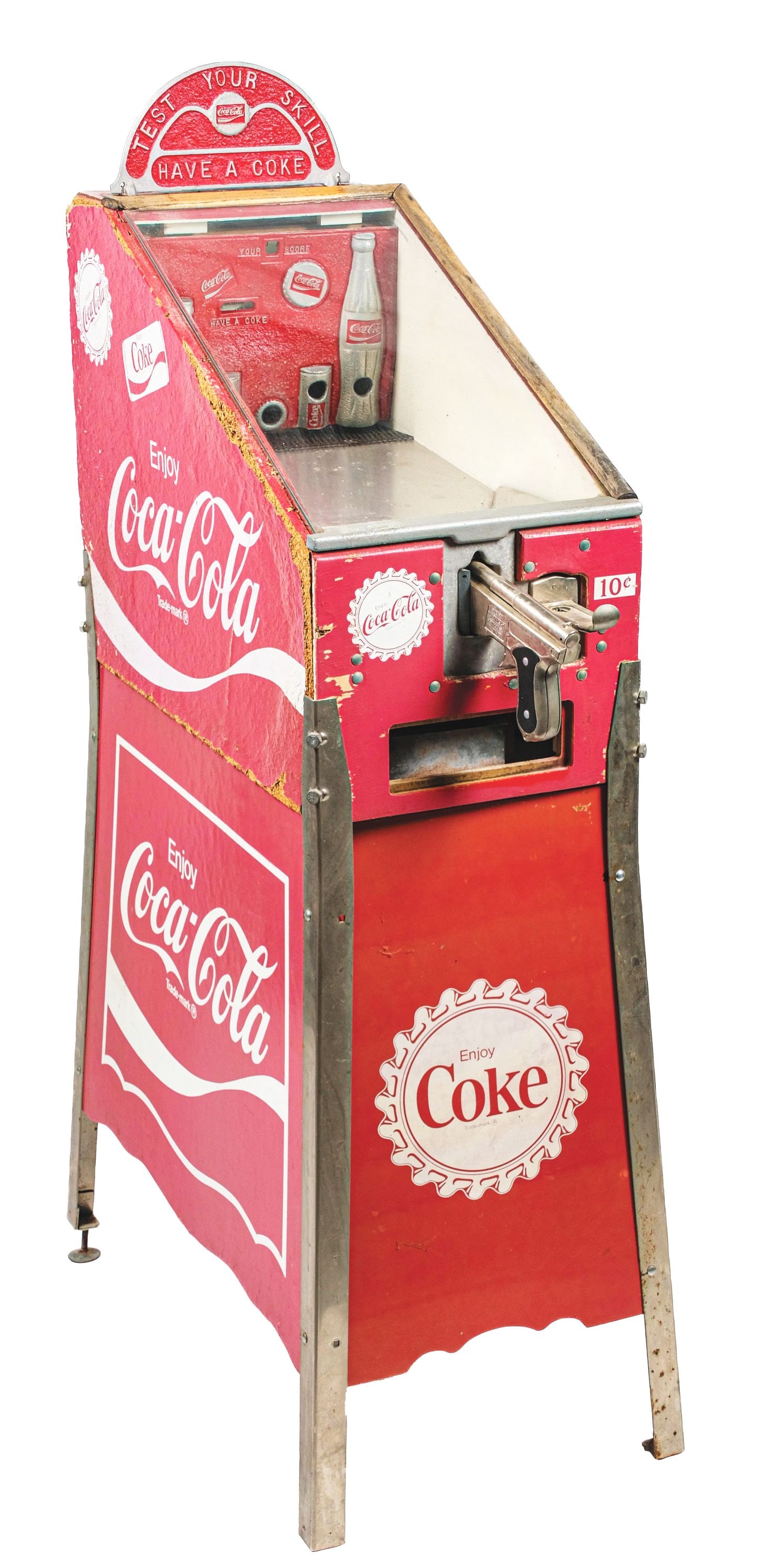 COCA-COLA-THEMED GUN GAME: This is an arcade gun game with a Coca-Cola theme made out of pressboard, with a glass front and a recast marquee. These were made in the 1960s and were sanctioned by the Coca-Cola Company. CONDITION: