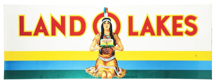 EMBOSSED TIN LAND O LAKES BUTTER SIGN W/ NATIVE AMERICAN GRAPHIC.
