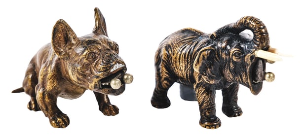 A PAIR OF CAST BRONZE FIGURAL CIGAR CUTTERS
