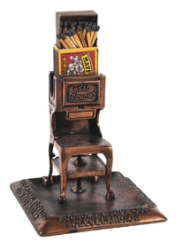 FIGURAL BRONZE MATCH HOLDER ADVERTISING THE ECONOMY STOVE CO.