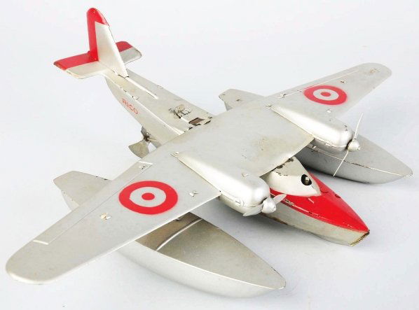 Tin Litho Rico Seaplane Wind-Up Toy.: Spanish. Working. This plane was made both pre and post-war. Marked "Rico" on fuselage. This is a copy of a German plane with bottom water propeller and pontoon on each side. Some moderate litho loss