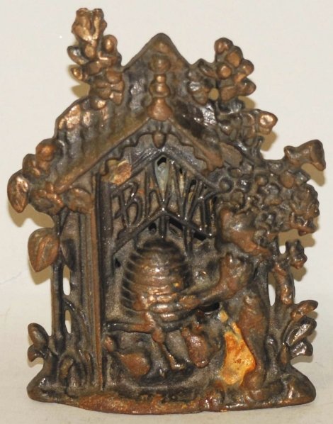 Cast Iron Honey Bear & Beehive Still Bank.: Minor rust to base. Condition (Very Good). Size 5 - 1/2" T.