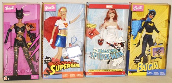 Lot of 7: Barbie Superheroes in Boxes.: Includes Barbie Bat Girl, Cat Woman, Wonder Woman, and several others. Condition (Near Mint). Size Largest Box: 13 - 1/2" x 9".