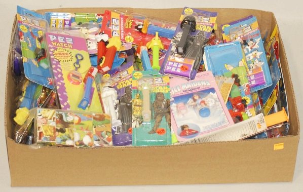 Lot of Assorted Modern Pez Dispensers.: Includes Star Wars, Disney, Peanuts, and other character Pez dispensers. Mostly in original packaging. Condition (Very Good - Excellent). Size Largest Box: 12" x 9 - 1/2".