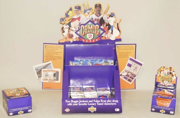 1991 Upper Deck Comic Cards With Store Display.: This lot includes two full boxes of comic ball card packs and numerous loose packs. Condition (Very Good - Excellent). Size Display: 21" T.
