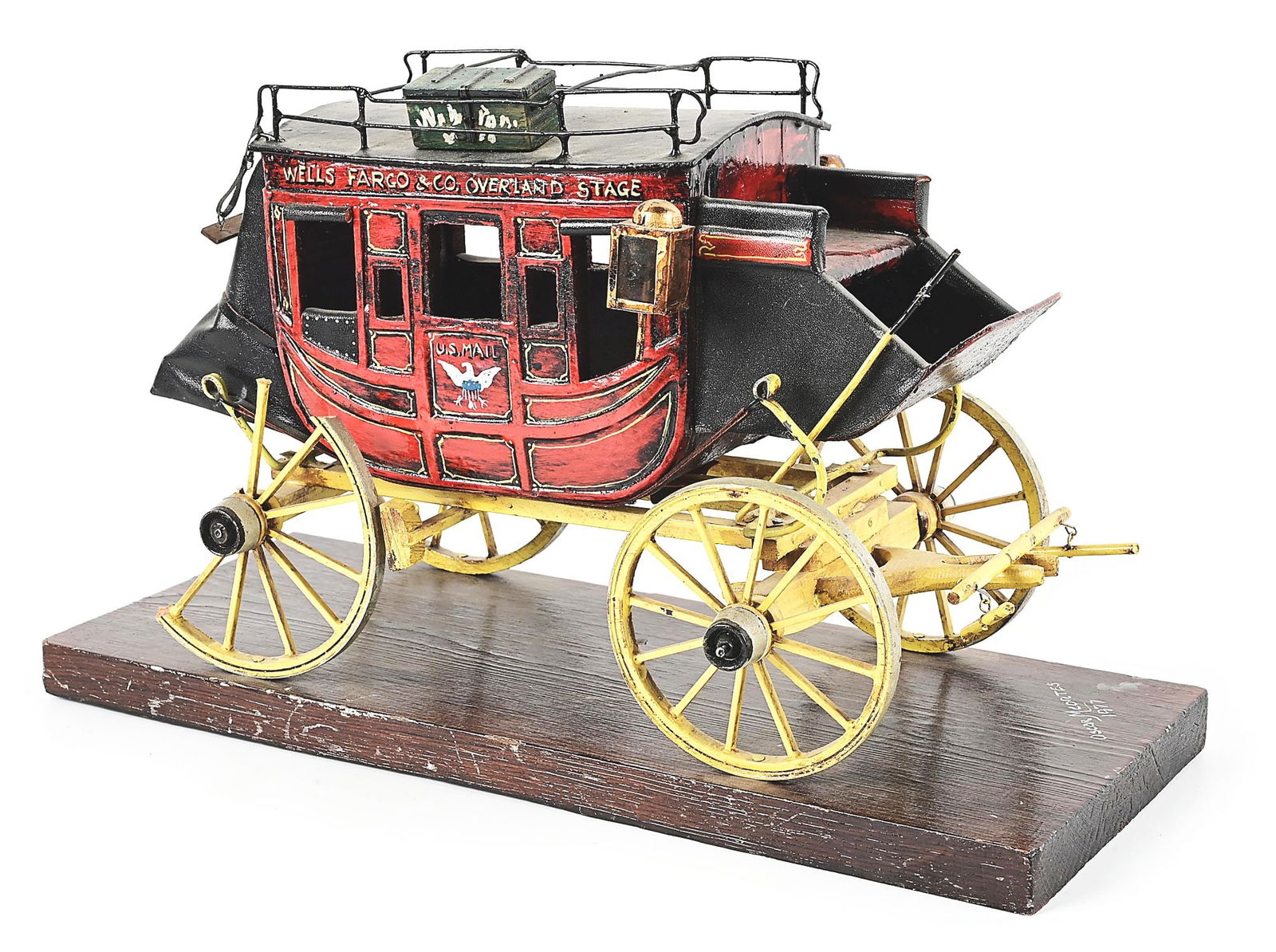 MINIATURE WOODEN WELLS FARGO & CO OVERLAND STAGE COACH MODEL.: Nicely detailed model of Wells Fargo coach, made of wood. CONDITION: Good.