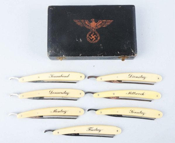 Nazi Straight Blade Razor Set.: Ivory handle with seven razors marked with the day's of the week in German. Comes with leather case wit Nazi insignia. Condition (Excellent). Size Box: 7" x 4 - 1/4".