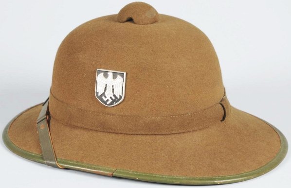 German Nazi Afrika Korps Army Pith Helmet.: Second pattern tropical pith helmet. The outside is covered in an olive draped felt. The left side is affixed with the Wehrmacht eagle which is the bird with the half-closed wings clutching a mobile s