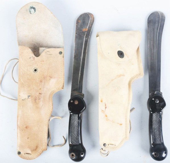 Lot of 2: Imperial Folding Machetes.: Includes one Imperial folding survival machete in correct leather holster marked "Machete with Sheath Type A-1 #480339" and one Imperial folding survival machete in correct leather holster (unmarked).