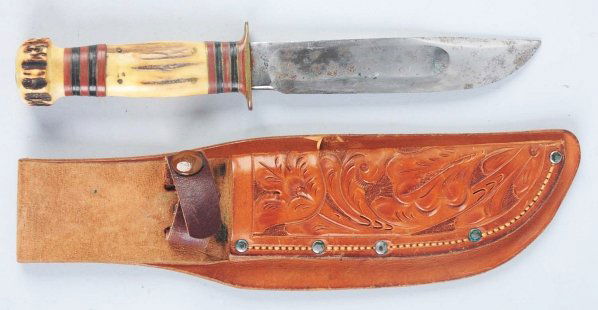 Marbles Gladstone "Ideal" Sheath Knife.: Stag crown on handle. This knife is in a fine, possibly hand tooled, reinforced sheath but is incorrect for this knife. Condition (Good - Very Good). Size Blade: 5 - 7/8" L.