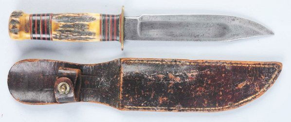 Marbles Goldstone "Ideal" Sheath Knife.: Stag crown on stag handle. Knife is in correct sheath with signed button. Condition (Good - Very Good). Size Blade: 6 - 1/2" L.