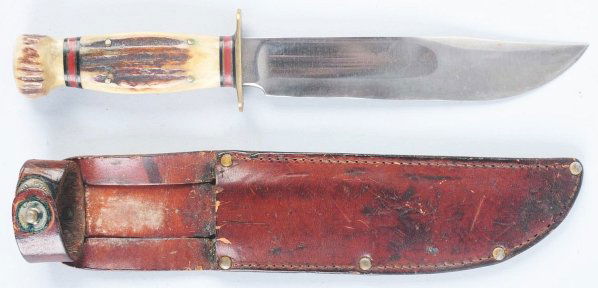 Marbles Gladstone "Ideal" Sheath Knife.: Stag crown on stag handle. Knife is in correct sheath with signed button. Condition (Very Good - Excellent). Size Blade: 6" L.