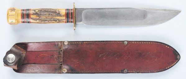 Marbles Gladstone "Ideal" Sheath Knife.: With stag crown on stag handle. Knife is in correct sheath with signed button. Condition (Excellent). Size Blade: 7 - 7/8" L.
