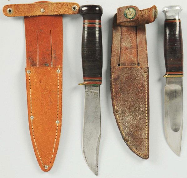 Lot of 2: Marbles Gladstone Sheath Knifes.: Includes one Marbles "Ideal" sheath knife with aluminum crown on stacked leather handle. Knife is in Marbles sheath with signed button. Also includes Marbles "Expert" sheath knife with composite crown