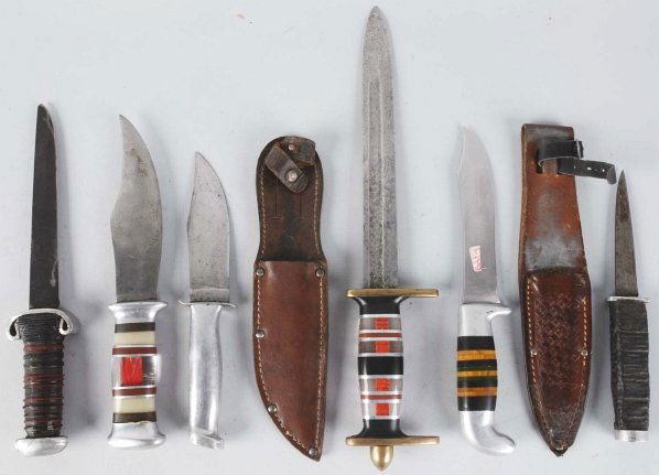 Lot of 5: Unsigned Handmade Theater Knives.: Includes one spear fighting knife with brass mounts, positive grip handle composed of black/clear/red composite spacers alternating with aluminum spacers, and no sheath and one clip point sheath knife