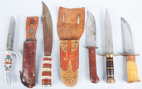 Lot of 5: Unsigned Handmade Theater Knives.: Includes one clip point bowie style fighter with walnut handle, heavy owl brass guard, and a massive reinforced handmade leather sheath along with a dagger fighting knife with heavy brass mounts, nice