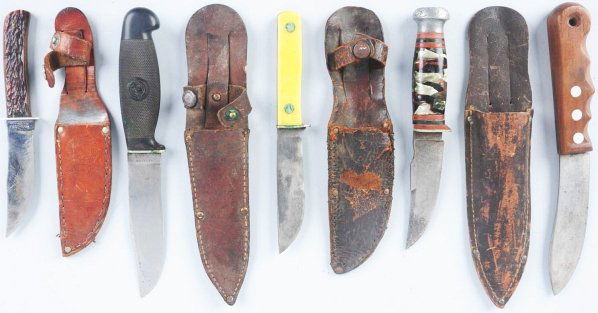 Lot of 5: Sheath Knives.: Includes one Remington Dupont (RH405) sheath knife with skinning blade, walnut finger notched handle, and leather sheath, one Bern-Shaw (Remington Contract) clip point sheath knife with aluminum oval