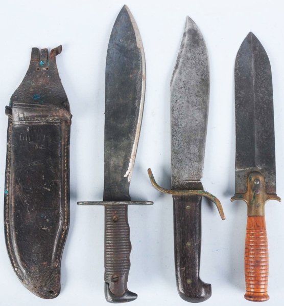 Lot of 3: Large Fized Blade Military Knives.: Includes one Western Bowie USA pilot's survival bowie with all hardwood handle, large brass S-guard, and correct leather sheath inscribed with locations on back, one US Springfield model 1880 brass gu