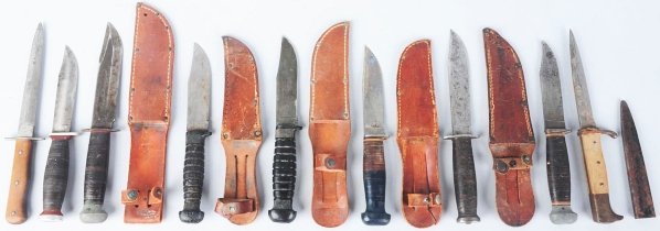 Lot of 9: Sheath Knives.: Includes one German trench knife with hardwood handle and iron guard, one Karl Eickhorn German trench knife with hardwood handle, bird's head iron crown, and finger guard, and one unsigned commercial 