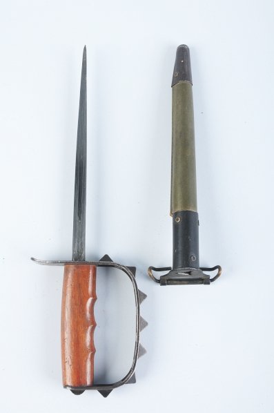 U.S. L.F. & C. 7-Knobbed Guard Trench Knife.: 1917. Correct sheath is included. Condition (Very Good - Excellent).