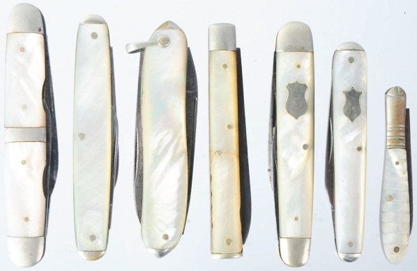 Lot of 7: Pearl Pocket Knives.: Includes one Cattaraugus three-blase pearl doctor's knife with cracked handles and blades that have good snap in both directions, one Hammer Brand three-blade pearl sleeve board whittler knife with wo