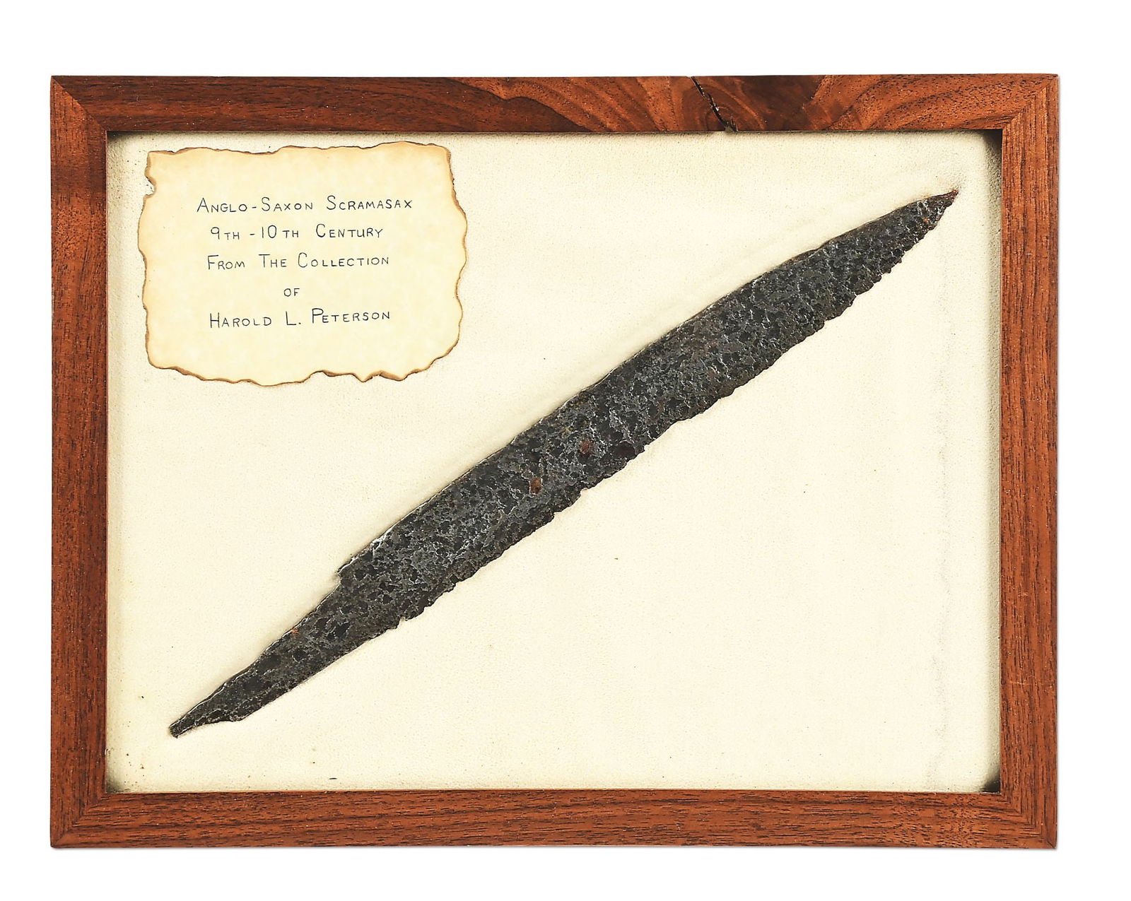 ANGLO SAXON SCRAMASAX BLADE.: Fine large example that features a 12 - 3/4" blade and 16 - 3/4" overall length. Spearpoint with wide tang. Heavy pitting with rough surface. Professionally conserved with a glossy patina. Displayed i