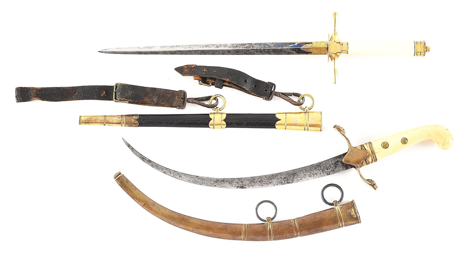LOT OF 2: IVORY HANDLED NAVAL DIRKS.: Lot consists of (A) Double edged straight diamond-section blade with blued and gilded decorations. Gilt brass cross guard and pillow pommel, octagonal ivory grip. Complete with its original leather sc